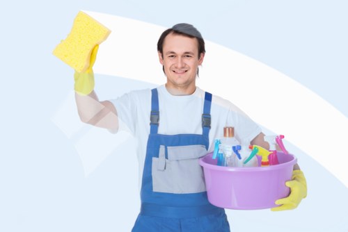 Staff wearing PPE during a professional cleaning task