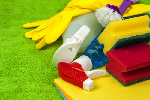 Cleaner maintaining shared hallway floors and handrails