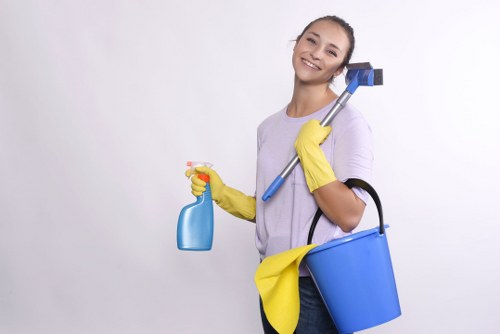 Local oven cleaner working in a compact Edgware apartment kitchen